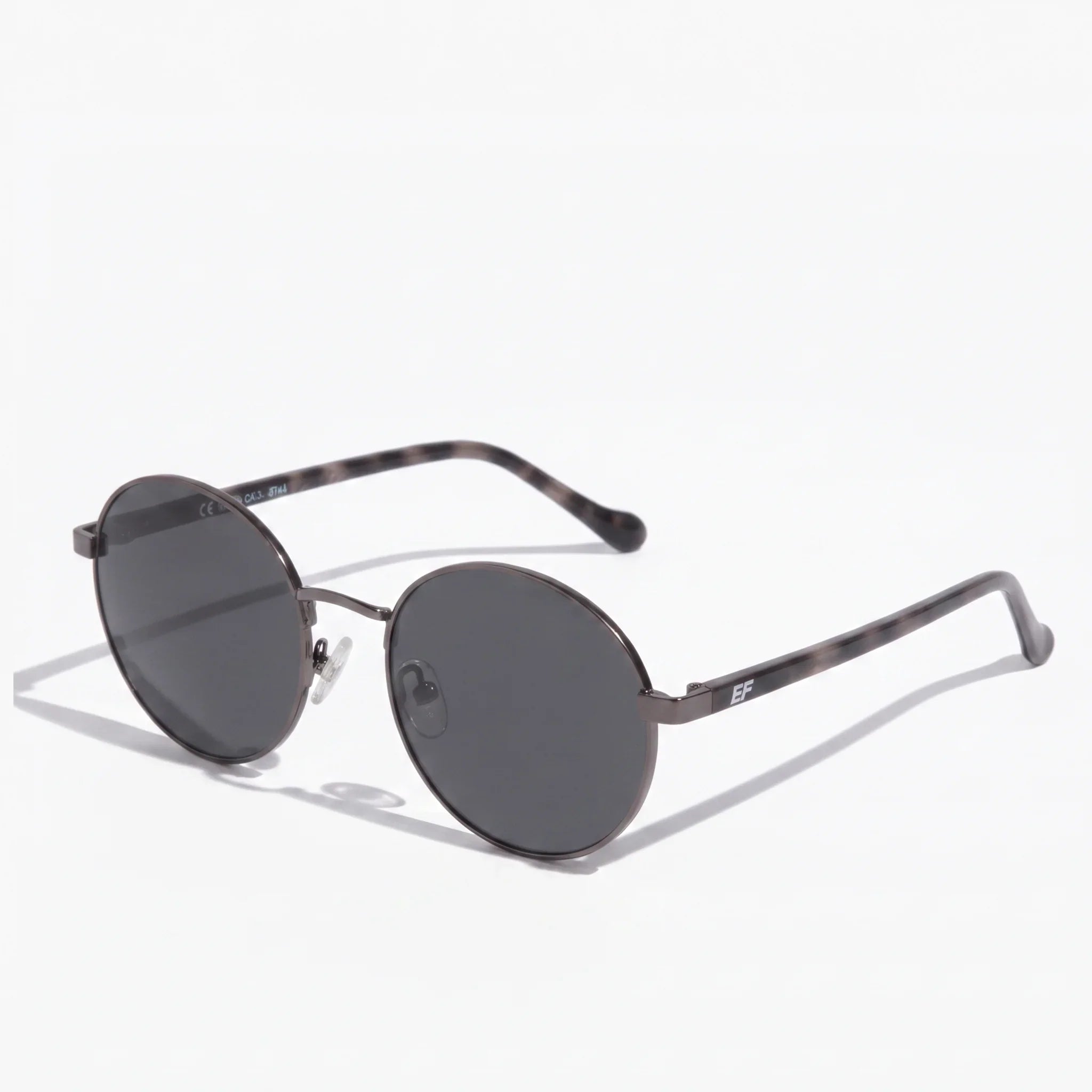 Round polarized sunglasses with dark lenses and grey tortoise shell acetate temples by EyeFend.
