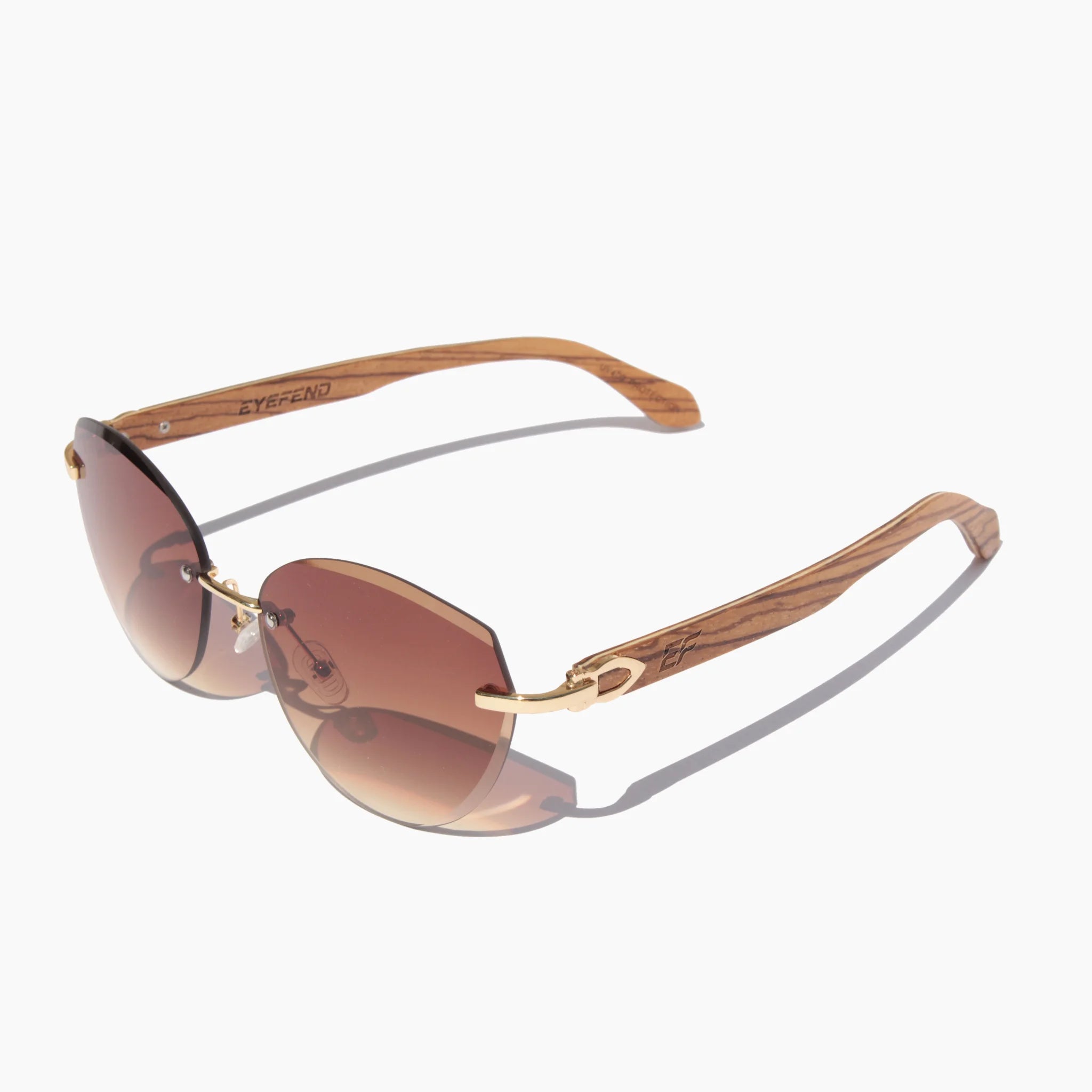 Modern rimless sunglasses featuring brown tinted lenses and gold accents, with wooden temples