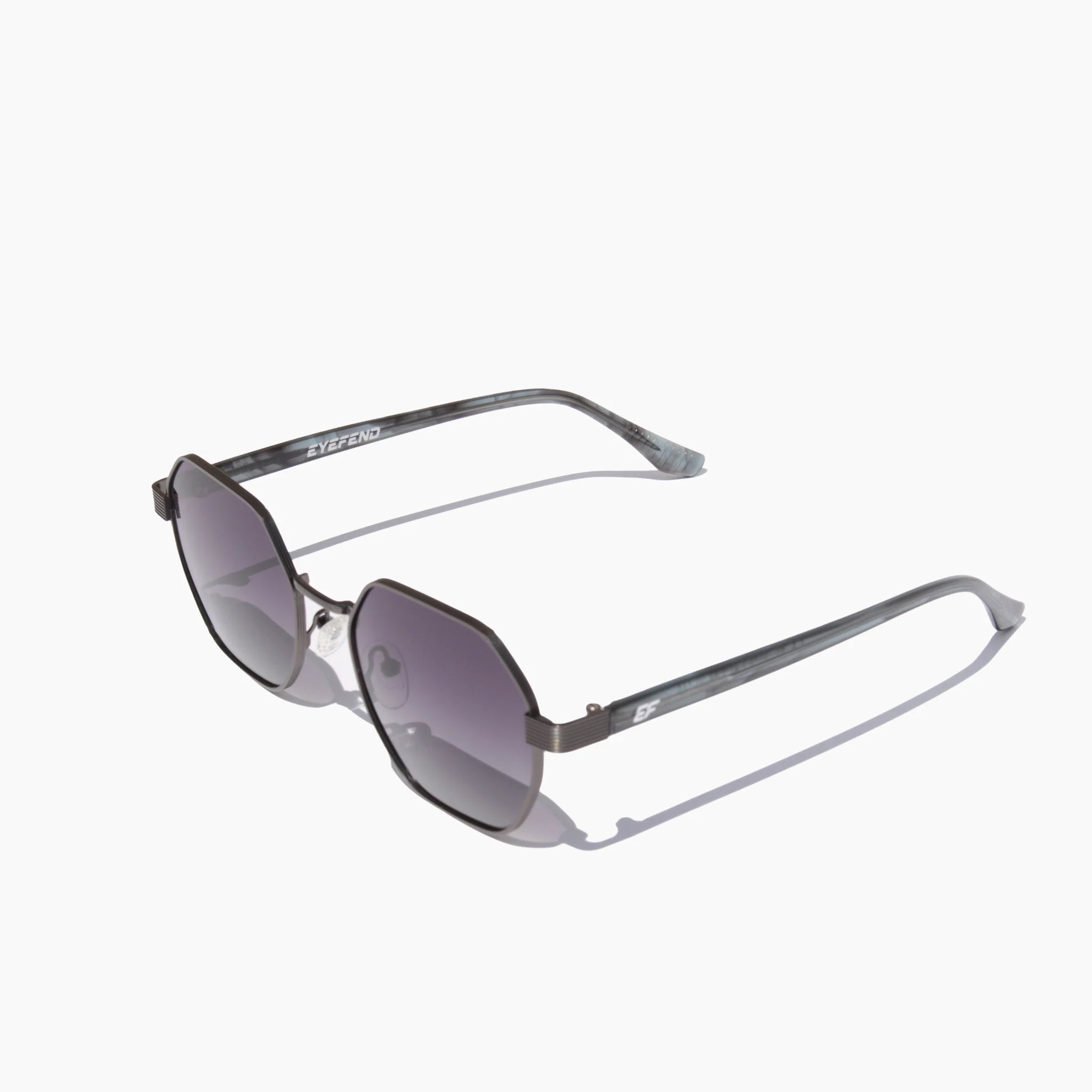 EyeFend Flex sunglasses featuring silver geometric frames with black gradient lenses and dark acetate temples.