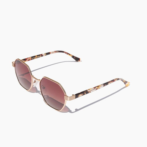 EyeFend Flex sunglasses featuring gold geometric frames with brown gradient lenses and tortoise shell temples.
