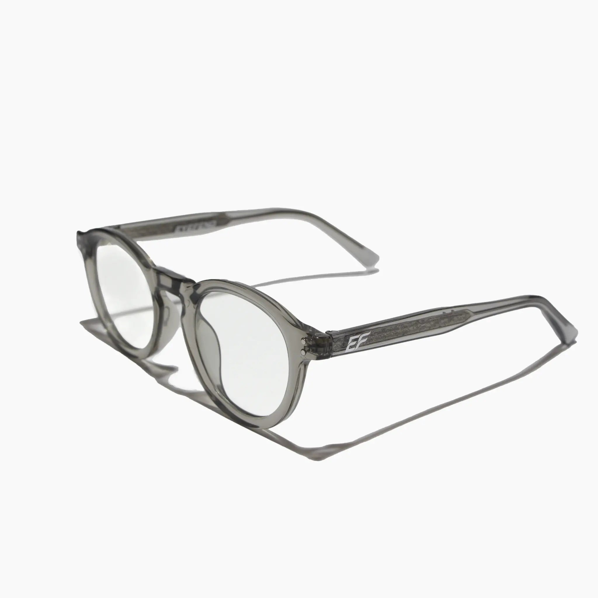EyeFend premium photochromic blue light glasses in a dark grey, rounded frame, featuring a minimalist structural design and durable multi-barrel rivet hinges.
