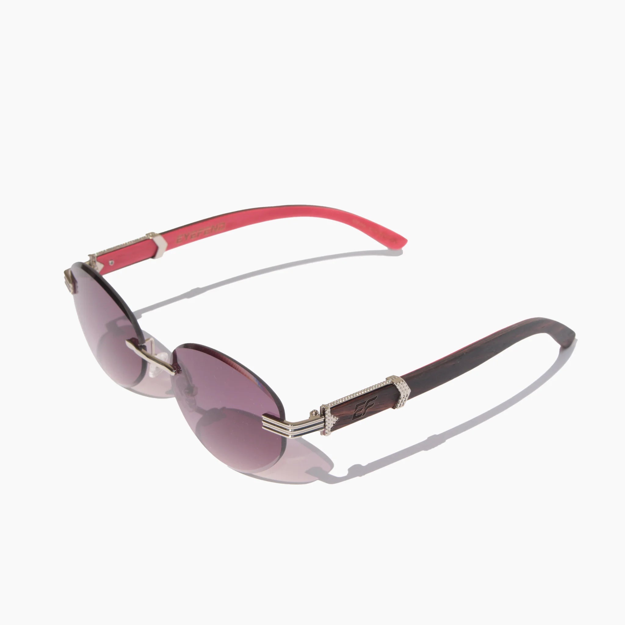 EyeFend Prime rimless oval sunglasses with purple lenses, a silver metal bridge, and dark wood temples