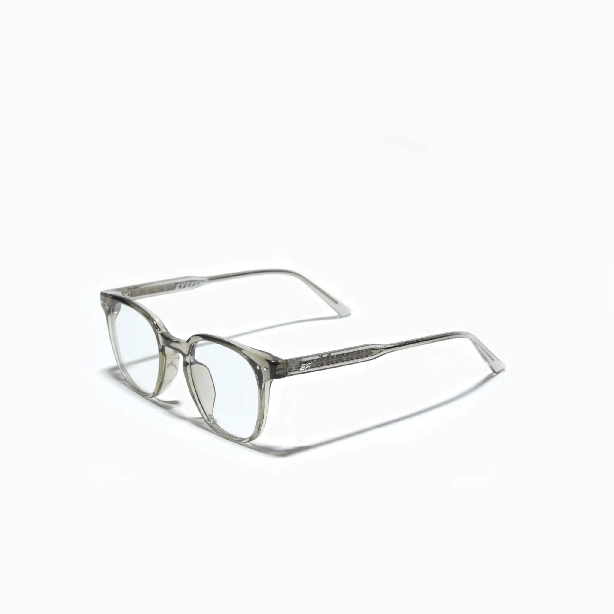 EyeFend premium photochromic blue light glasses in a rounded translucent frame, featuring a minimalist structural design and durable multi-barrel rivet hinges.