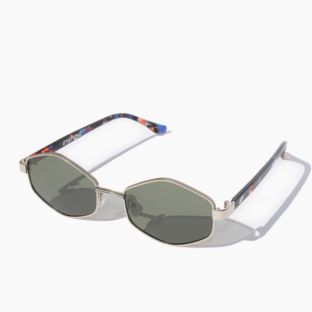 EyeFend Smart sunglasses featuring silver geometric hexagonal frames with green polarized lenses and tortoiseshell acetate temples.