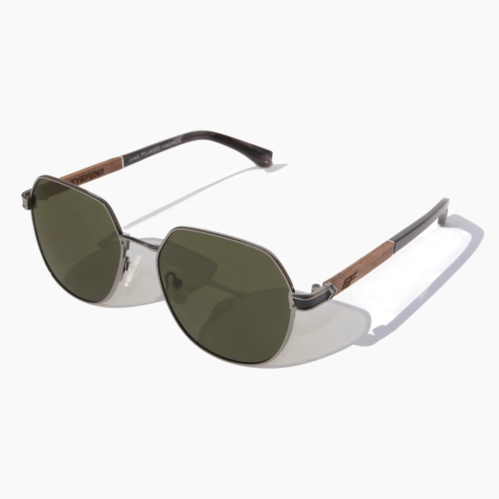 EyeFend Spark geometric aviator sunglasses featuring dark metal frames, green polarized lenses, and textured wood-grain with acetate temple details
